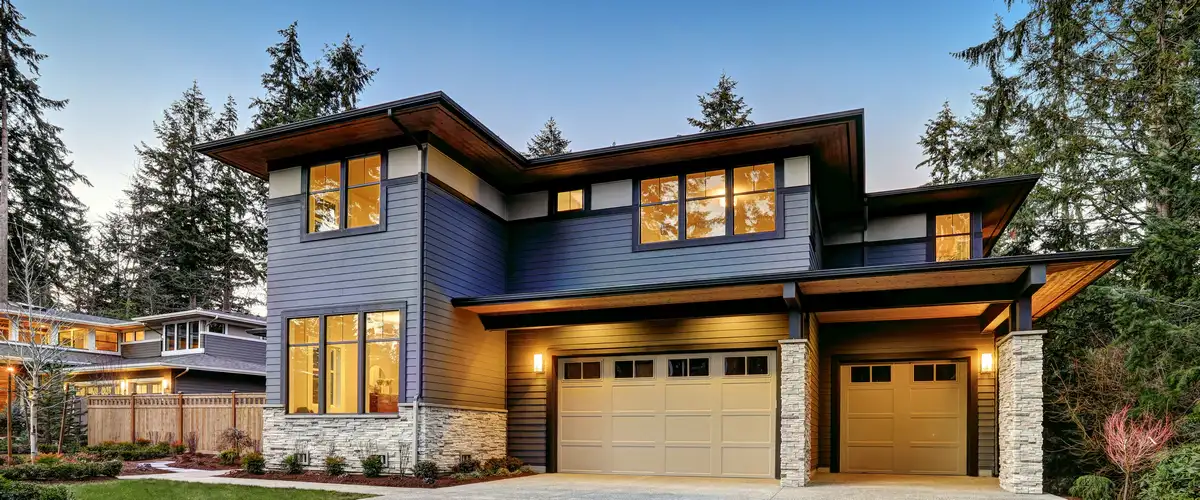 A modern residential home with clean architectural lines and updated landscaping.